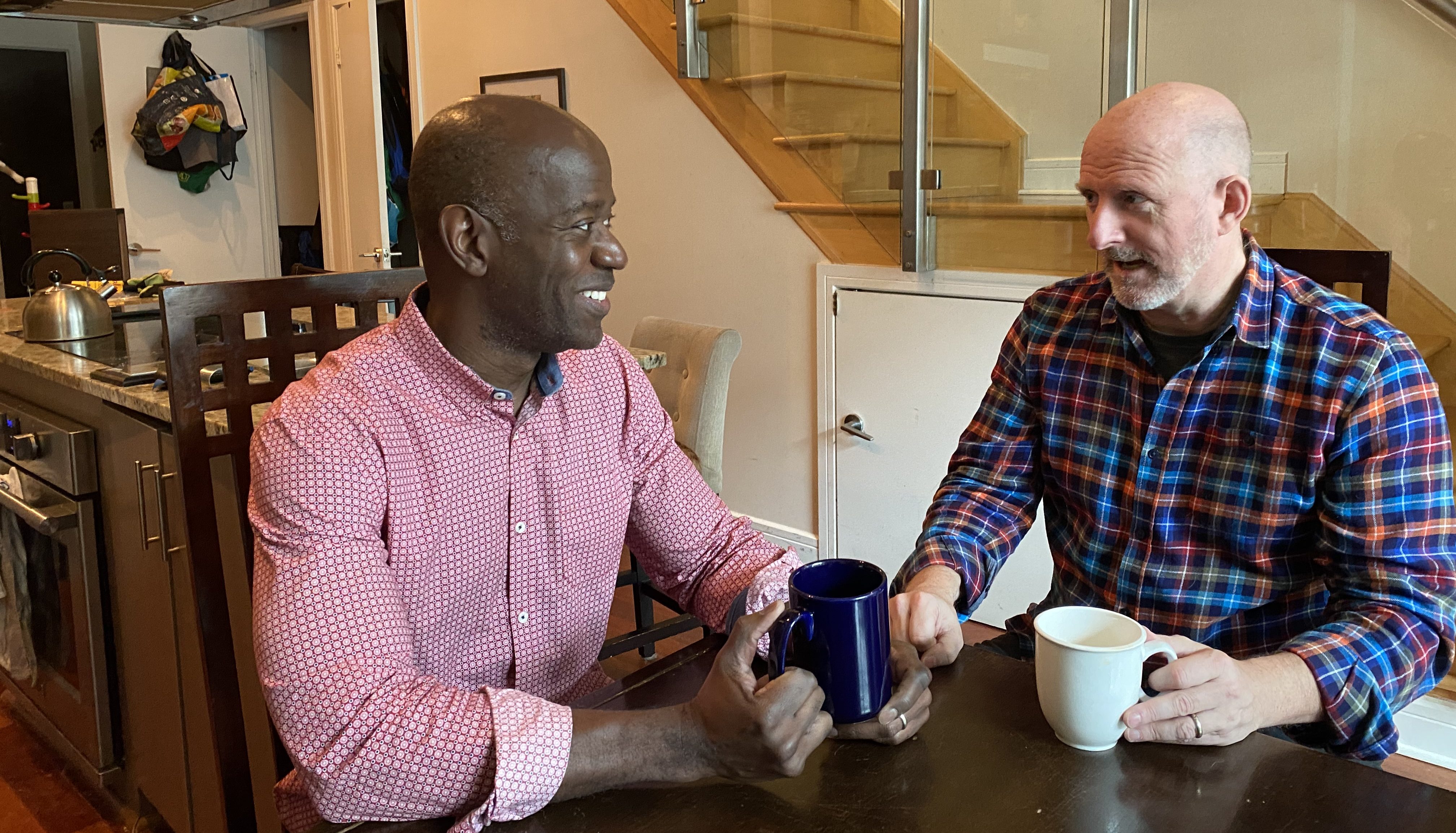 Picture of Doug Kerr and Michael Went at their dining table in their condo.