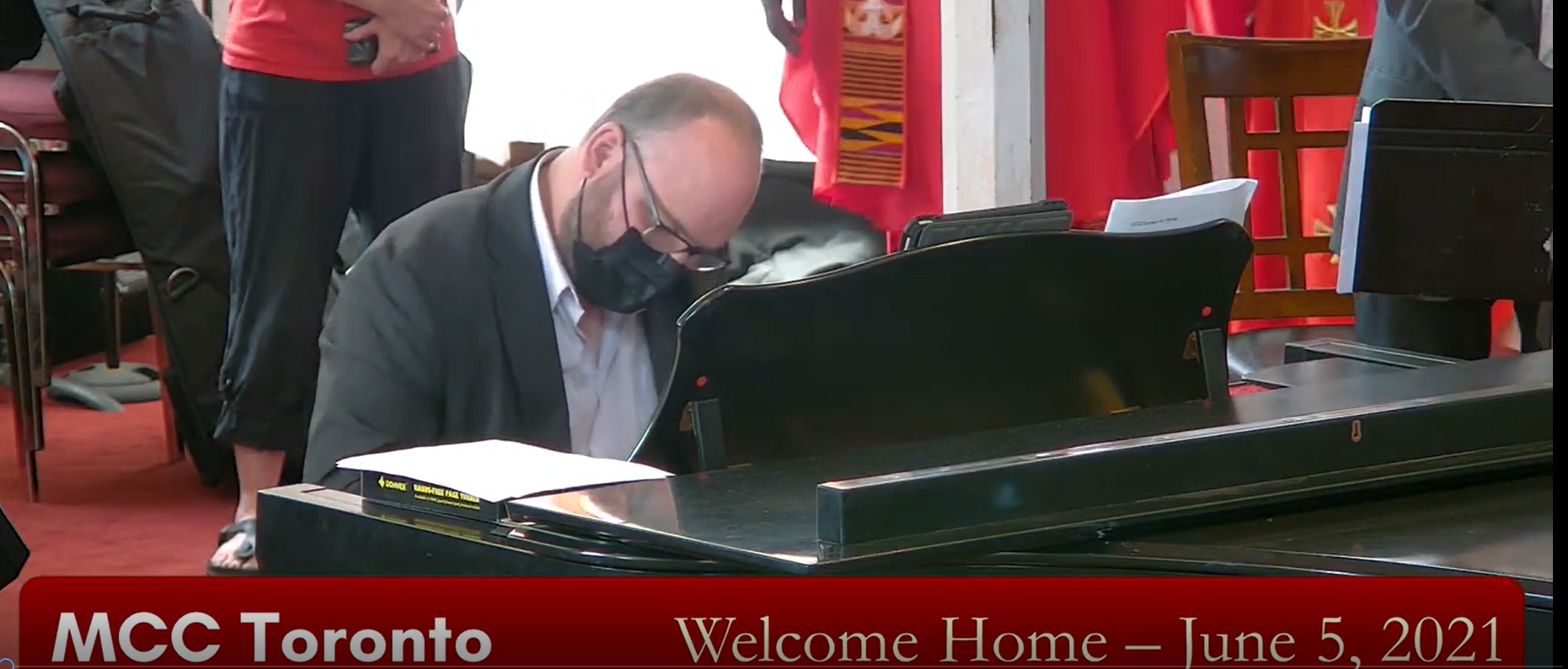 Picture of MCC Toronto's Music Director, Jason Jestadt playing piano in the Sanctuary.