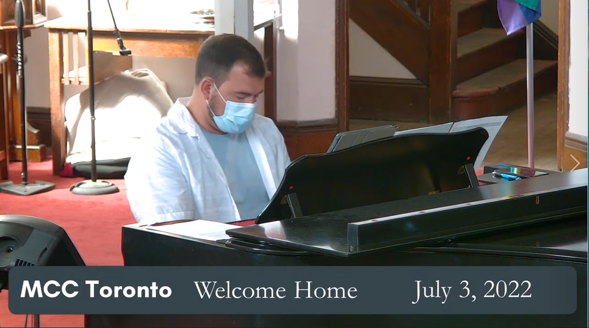 Picture of Scott Christian playing Piano in the Sanctuary of MCC Toronto