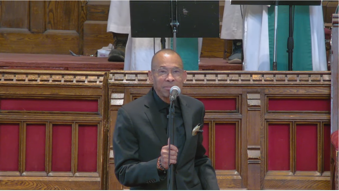 Picture of Billy Newton-Davis singing at the Sanctuary of MCC Toronto