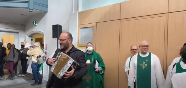 Our Music Minister Jason Jestadt playing accordion with The Choir of MCC Toronto in our Brand new Social Hall.