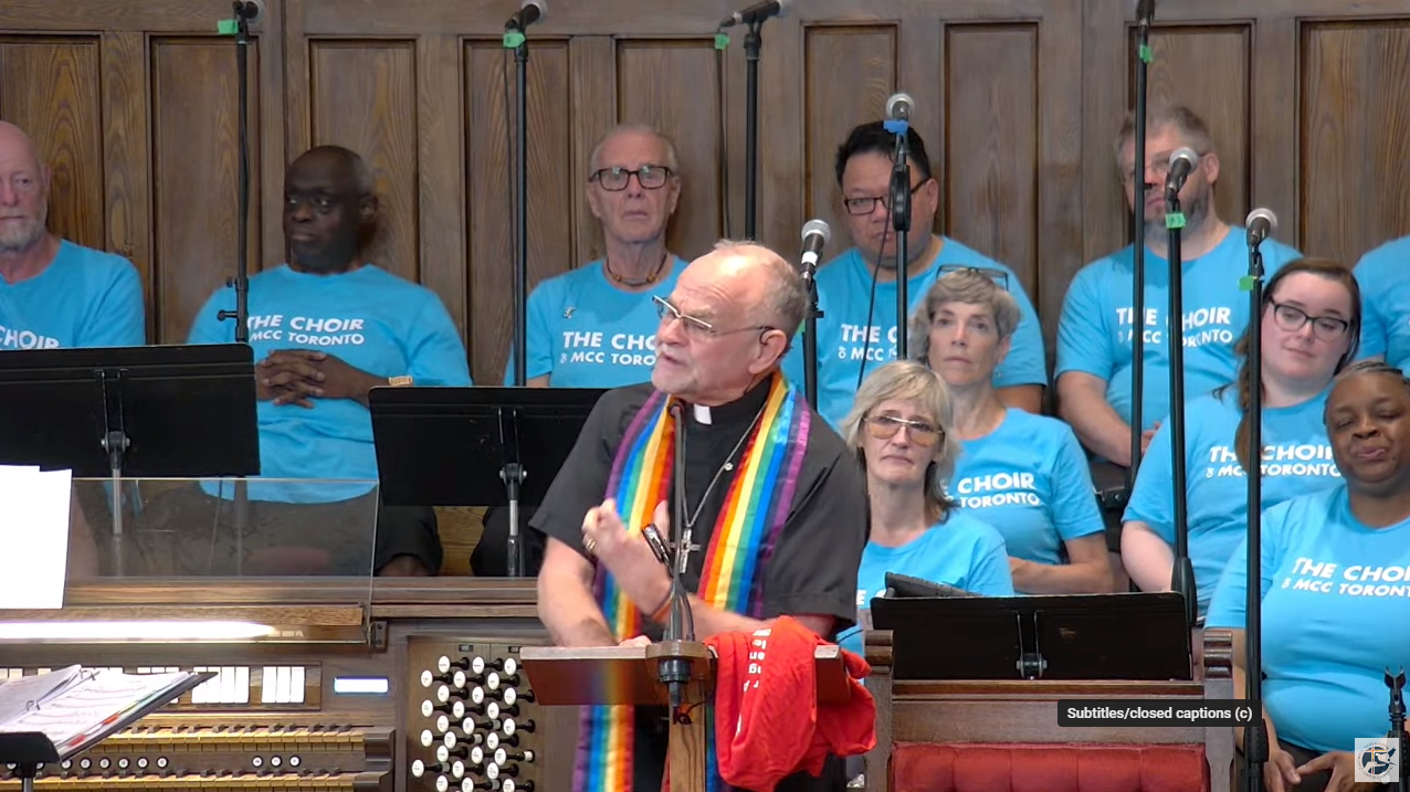 Picture of Rev. Dr. Brent Hawkes preaching at the pulpit of MCC Toronto's Sanctuary