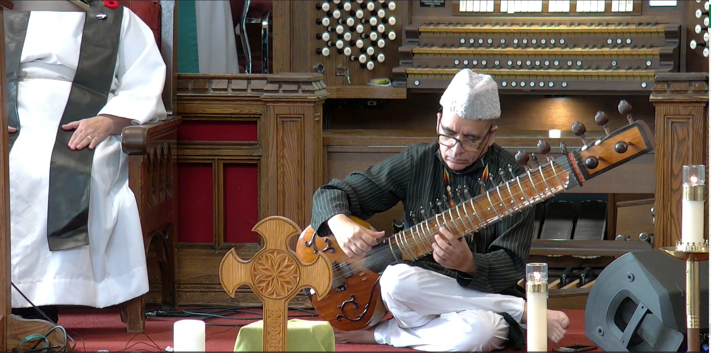 Picture of Anwar Khurshid Playing the Sitar on the pulpit of MCC Toronto's Sanctuary Sanctuary